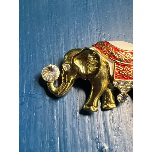 Vintage elephant pin brooch gold tone red white enamel rhinestones trunk up