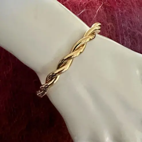 Gold tone twisted open cuff bracelet