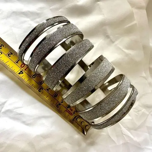 Silver tone glittery long wide arm bracelet