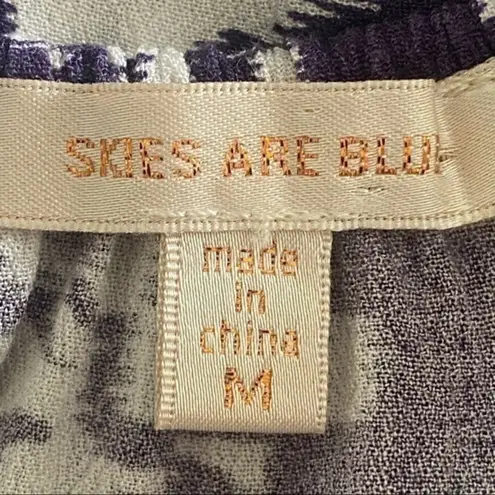 Skies Are Blue navy and white top with back cut-outs in size Medium. EUC