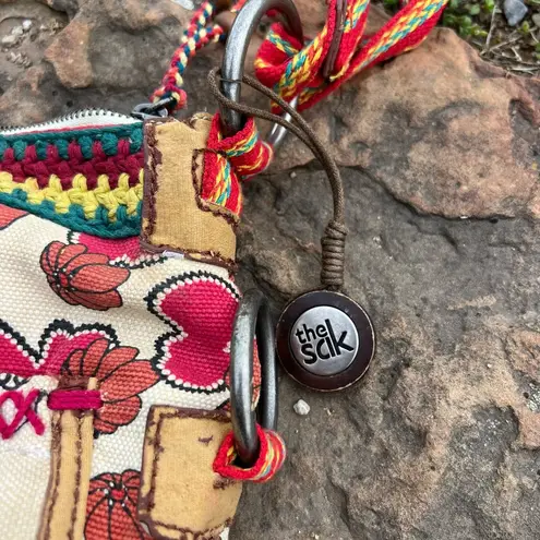 The Sak Sakroots Peace Red Circle Art Deco Cross Body Canvas Purse