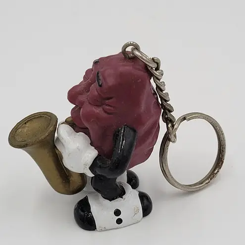 Raisin's California 1987 Vintage Raisin Saxophone Player Keychain