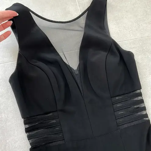 Women size small long black dress with small train bust and waist mesh detail