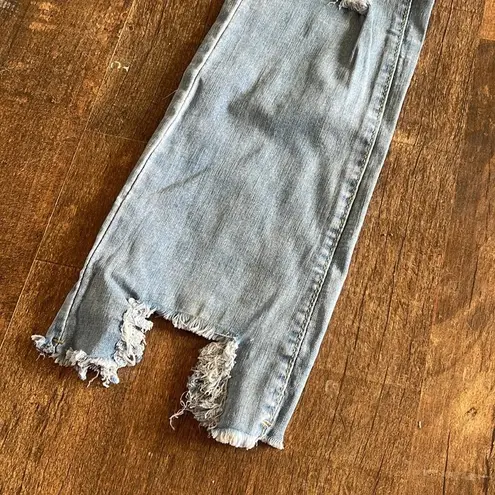 Stretchy distressed light wash/medium wash jeans new Size 4