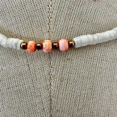 Shell and pink beaded puka necklace
