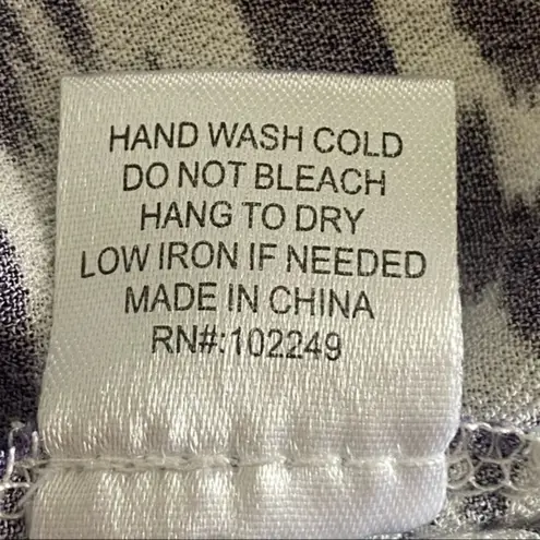 Skies Are Blue navy and white top with back cut-outs in size Medium. EUC