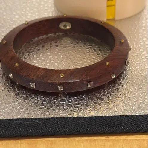 Silpada wooden bracelet with sparkle embellishments on the wood.