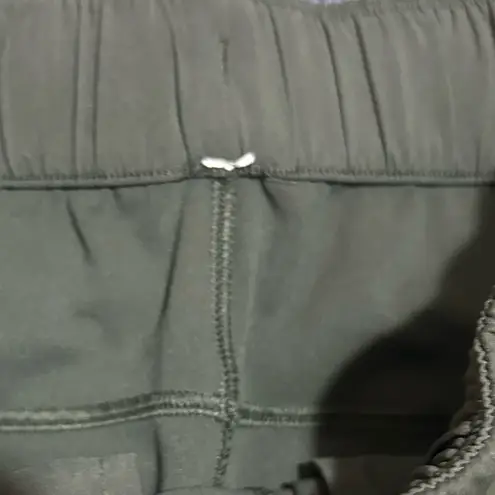 Lululemon  On The Fly Pant Woven 28"  
Olive Green Jogger Pants Size 2