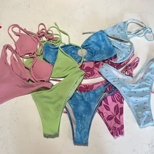 A lot of 5 sets of string bikinis. Tags have all been removed. Sizes are Small Size undefined