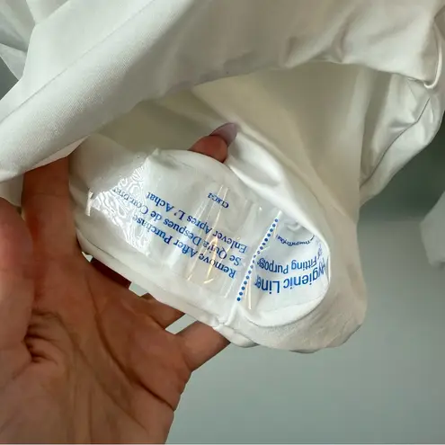 Trina Turk  Monaco Ring Front Long Sleeve Paddle Suit White M