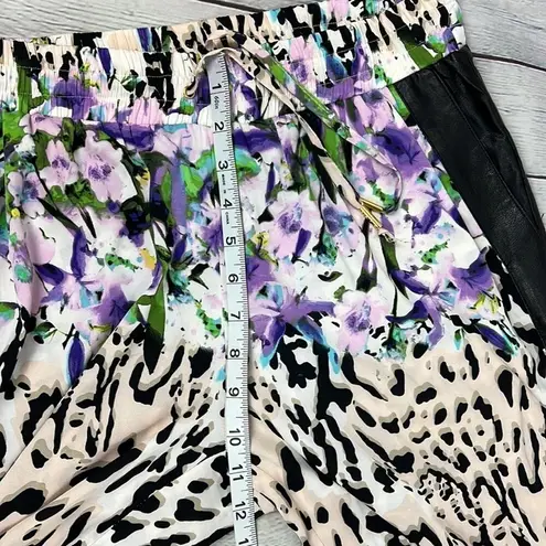 Bebe  Floral Animal print blend joggers with faux leather side pockets. Size M