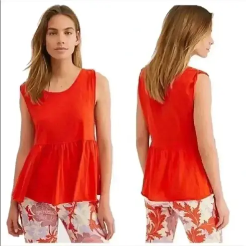 We The Free Free people  anytime peplum tank top in an orange color