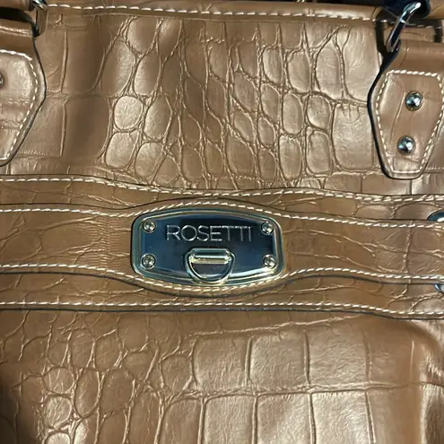 Rosetti  brown leather purse. Comes with mini purse attached to front pocket.