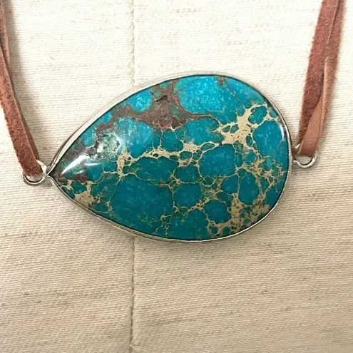 Turquoise tone side cord pendant necklace