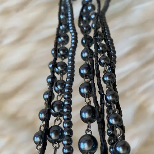 Pewter toned mixed media long statement necklace