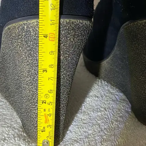 Kelsi Dagger  black suede wedge booties.