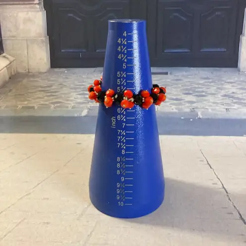 Source Unknown Pile of Red & Black Plastic Stretch Bracelets Louisville/Cal State/Grinnell