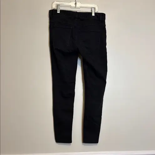 Free People  black skinny jeans with distressing at knees