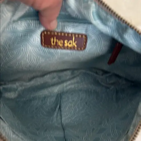 The Sak Cream Crossbody Bag with Sporty Elegance