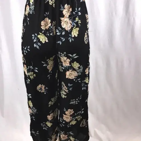 Xhilaration  floral pants romper size extra small  has a small rip New With Tags