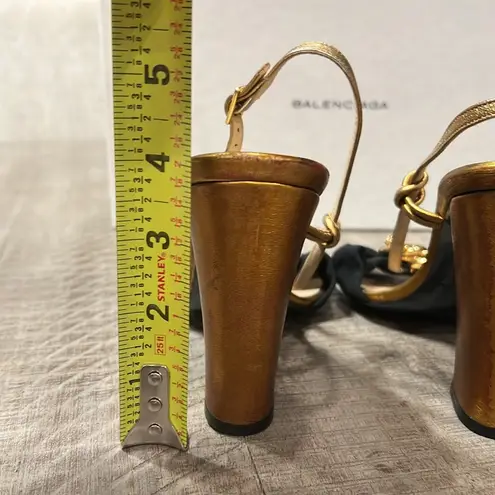 Balenciaga women’s gently used black and gold strappy sandals