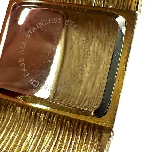 Green and gold tone watch bangle bracelet