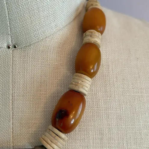 Handmade Vintage authentic African tribal necklace with metal center amber colored beads