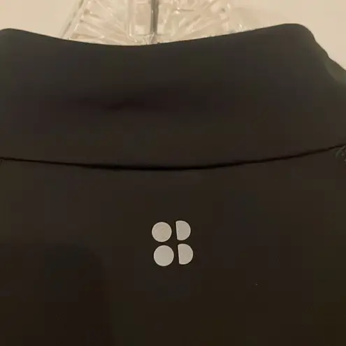 Sweaty Betty Thermodynamic Black 1/4 zip with Velvet stripes on Sleeves