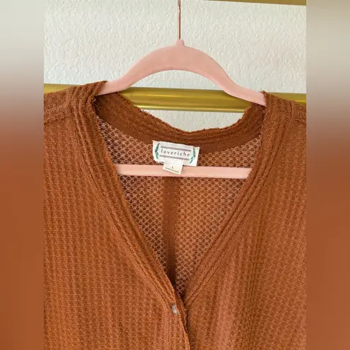 Love Riche Women’s orange button up shirt with tied bow knot