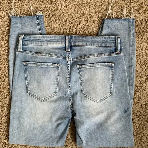 Pistola size 29 tapered leg light wash denim raw hem blue jeans