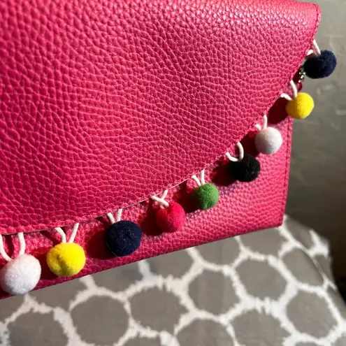 Pink Pebbled Clutch with Playful Tassel Pom Pom Trim