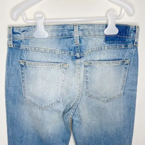 Amo Twist skinny light wash distressed jeans with front slit in sweet cheeks 27