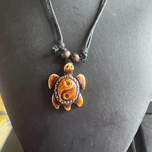 Yin Yang sea turtle necklace