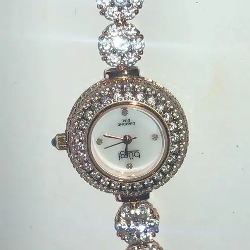 Burgi Ladies Diamond Dial BUR139RG Crystal CZ Rhinestone Rose Gold Tone Watch White
