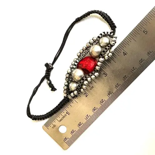 Silver tone red skeleton black cord bracelet