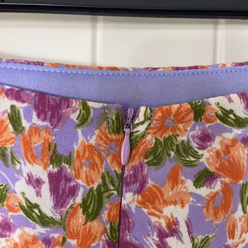 NWOT Fore women’s purple orange floral lined zip mini ruffle hem skirt summer M Size M