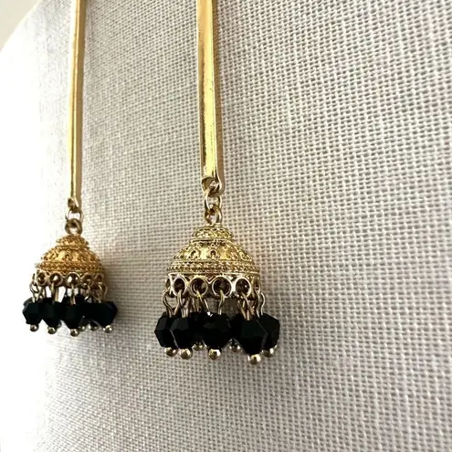 Gold tone black dangling bead Indian earrings