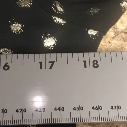 Abbeline  Size small women’s black with gold design V-neck blouse