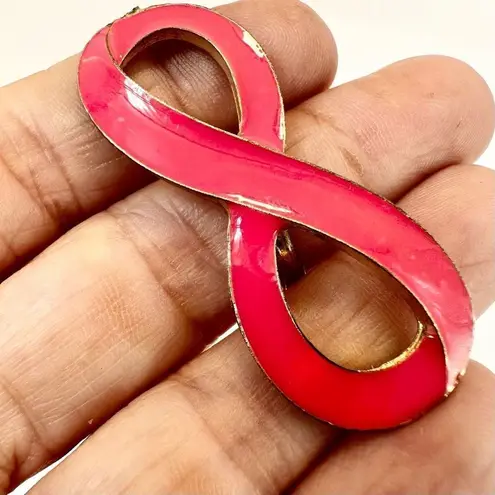 Pink and gold tone infinity ring