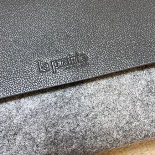 La Prarie clutch with brooch pin