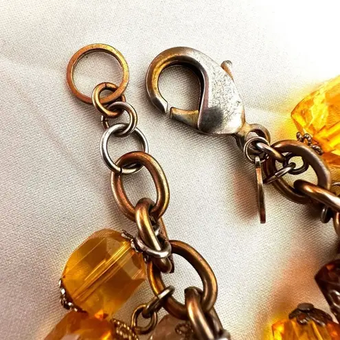 Joan Rivers  amber tone beaded charm bracelet