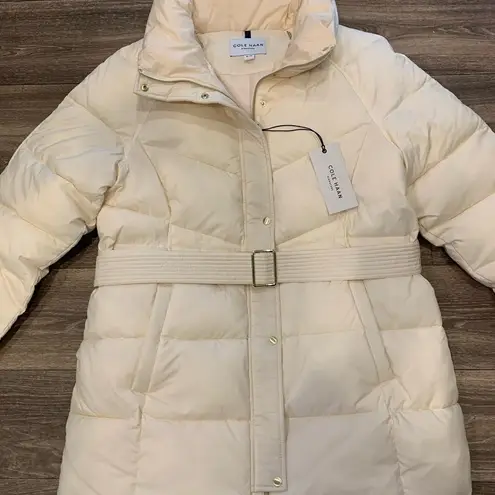 Cole Haan  NWT Puffer Coat.  Size: XL.  Gold tone zippers and buttons.  Belted