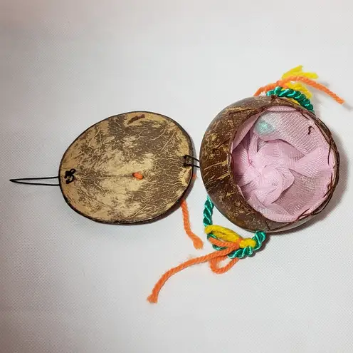 Coconut souvenir purse with painted face pearly bead nose & yarn handle Green