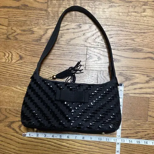 Nylon and vinyl weave purse. Great size with multiple separations. Black