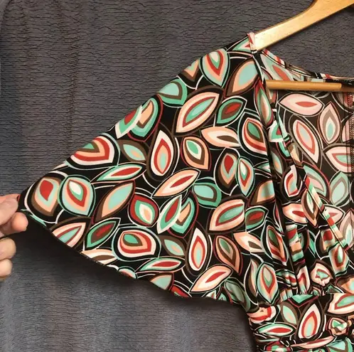 Intrigue , medium dress with flutter sleeves, a V-neck