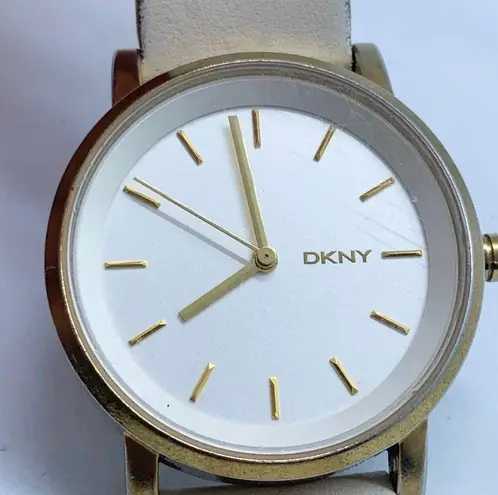 DKNY  women watch 34mm gold tone solid stainless steel white Leather band WR runs