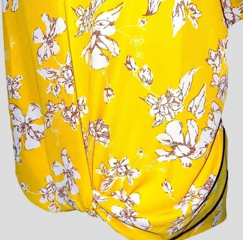 West Kei  pretty dark yellow twisted hem blouse with floral design! New