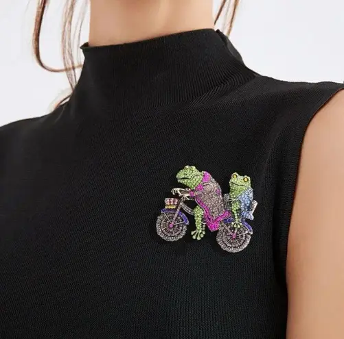 Brooch pin of two frogs riding a motorcycle adorned with sparkly crystals Gold