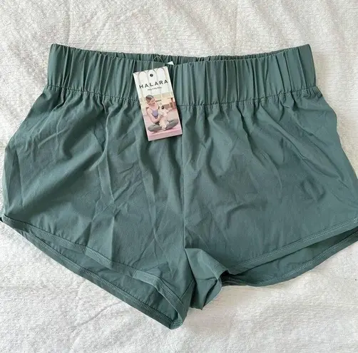 Halara  High Waisted Dolphin Hem Shorts Green Size L NWT