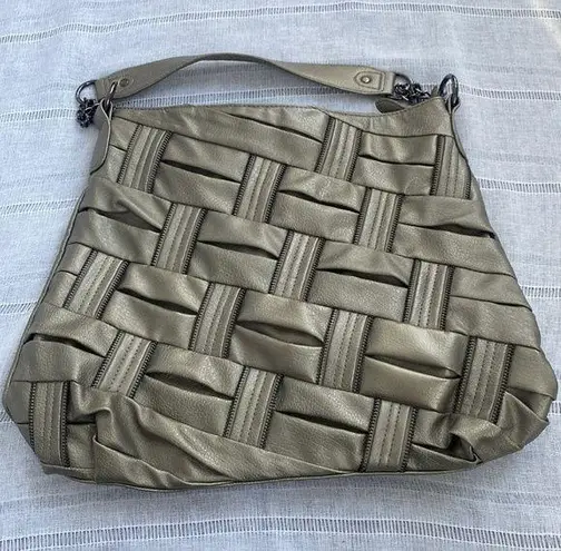 Olivia and Joy pewter hand bag with zipper embellishments.
